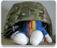 Petey wears a military helmet
