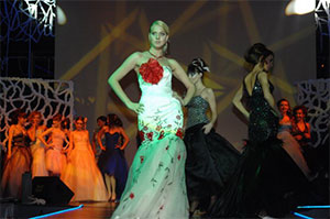 Oxana, modeling at a fashion show as a young woman in Russia
