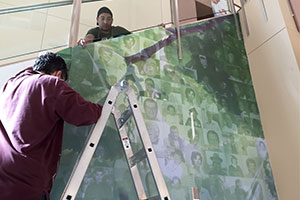 The Gift of Life Memorial Wall being installed in the Regions Hospital Atrium.