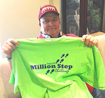 Fred holds up a Phillips Million Step Challenge tshirt.