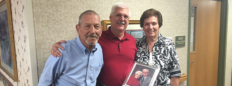 John Bergstrom, Jim Zentner and Lynn Zentner (holding a photo of Richard and Alma Zentner)