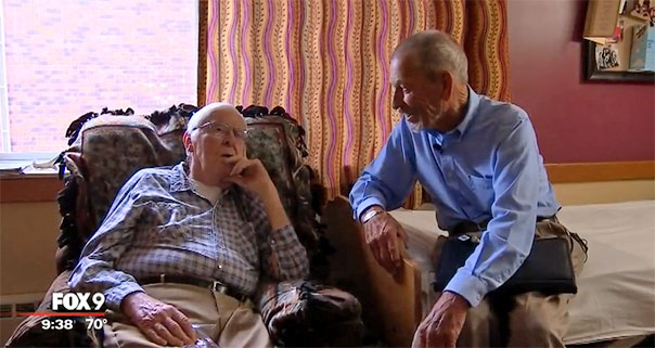 John Bergstrom sits and chats with Jim Zentner in a hospice room.