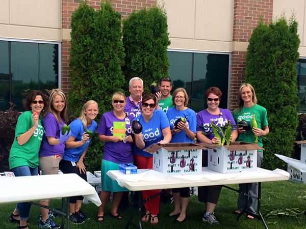 Image: MGH Blog - HealthPartners and Park Nicollet employees holding up various vegetables on location
