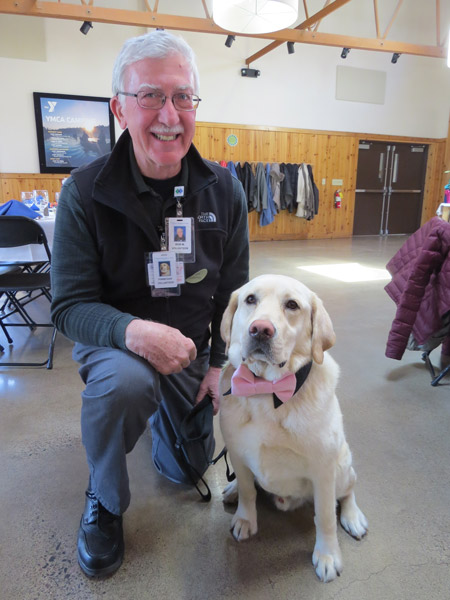 Pet therapy program volunteers Bob Molenda and Finnegan.
