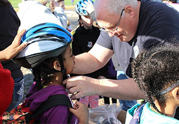 A helmet fitting that took place at Castle Elementary in Oakdale, Minn. for National Bike to School Day 2016.