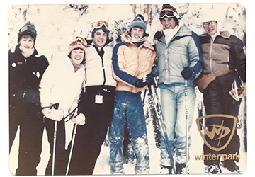 An old faded photograph of Colleen Crownhart posing with friends during a ski trip. 